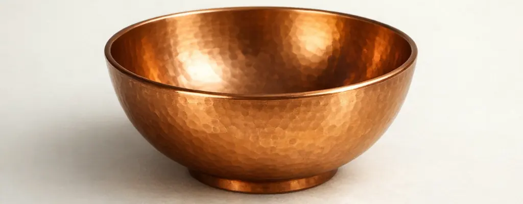 Hand-hammered copper bowl on a soft neutral backdrop